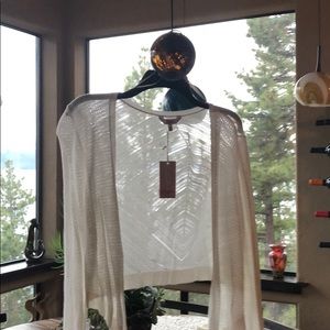 White Shrug with security device attached 😂